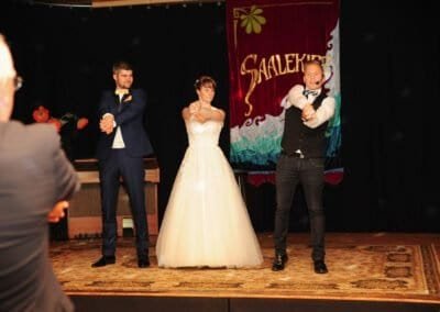 Wedding magician Henry Oz performing for bride and groom