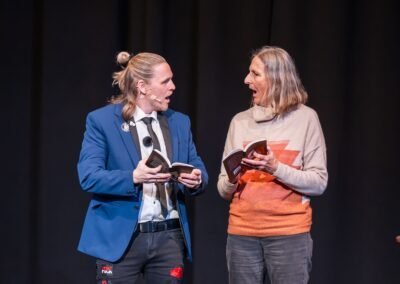 German magician Henry Oz performing a mentalism book test with a volunteer during a theater show on Lopez Island